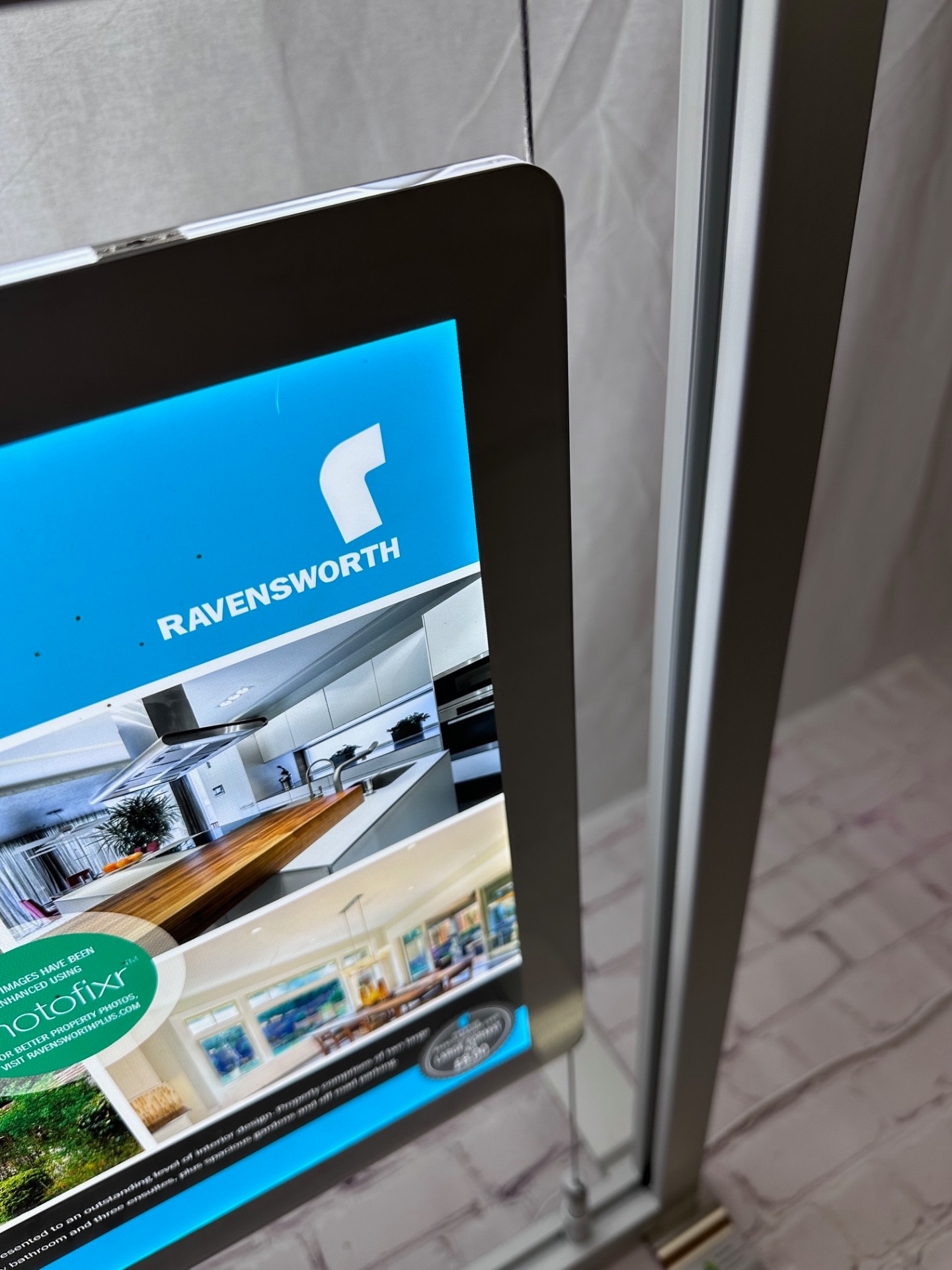Ravensworth estate agent poster illuminated on freestanding LED display